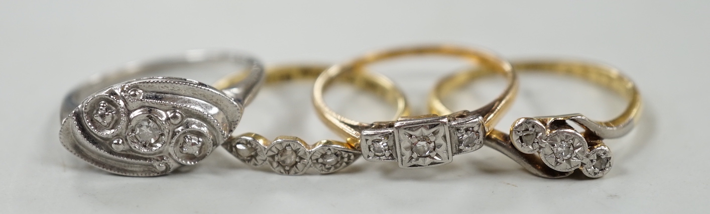 Two 18ct, plat and illusion set three stone diamond rings and two other similar white metal rings, one stamped 9ct